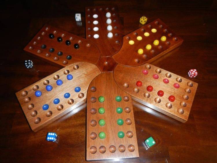 Board game, 2-4 players, move four marbles from base to home.