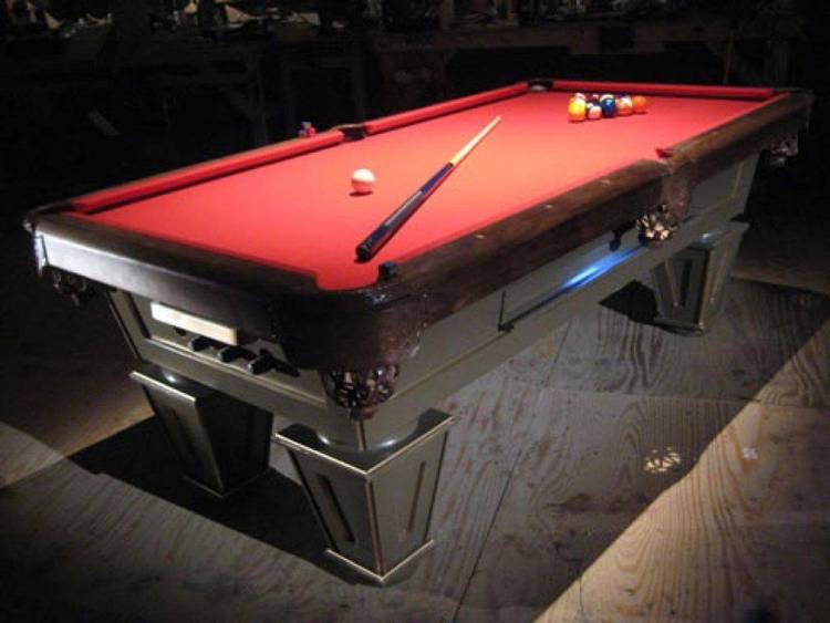 This program simulates a pool table with a standard rack of 15 numbered balls and a cue ball. The player can manipulate a cue stick on the screen to aim and shoot at balls on the table.